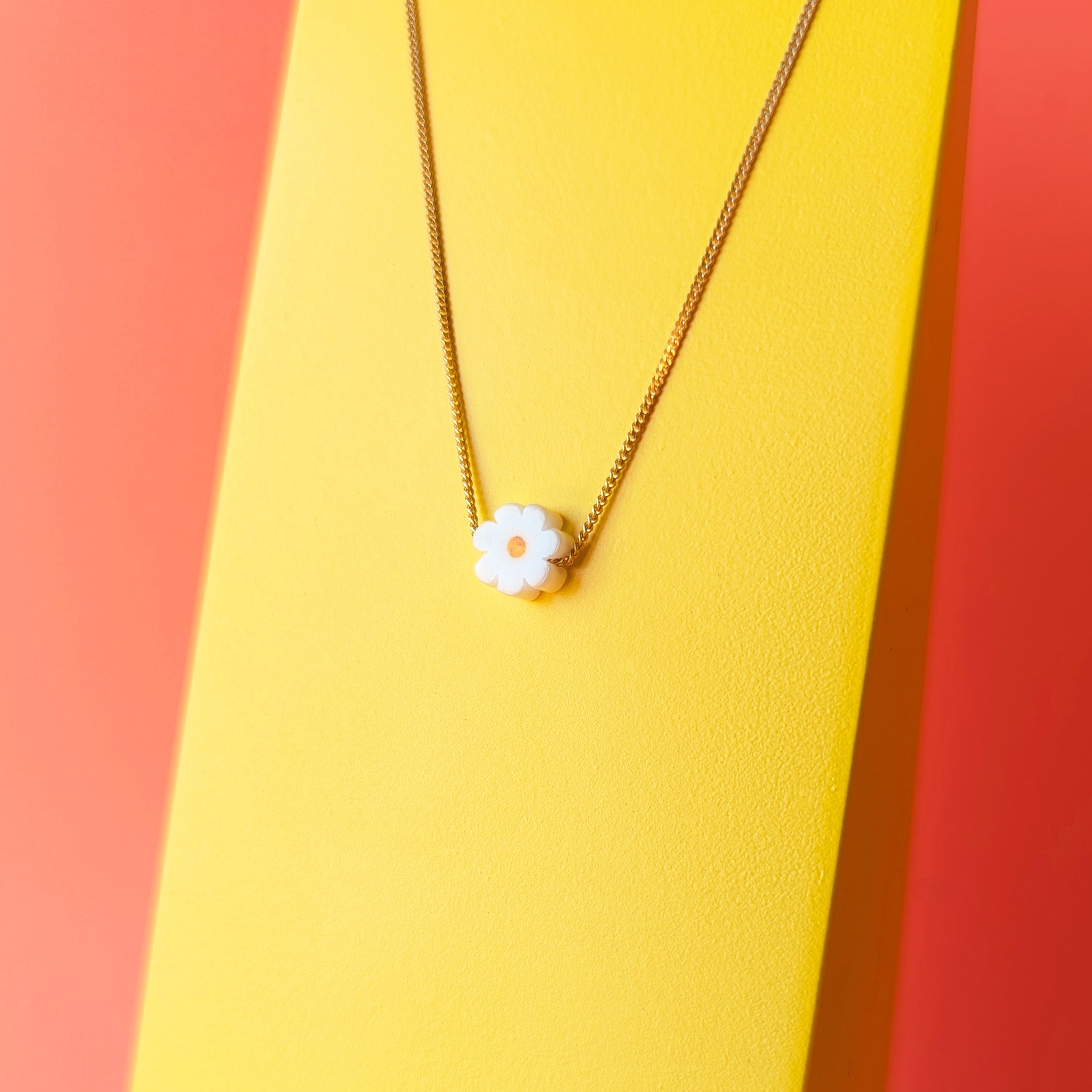 Daisy pendant on fine gold chain