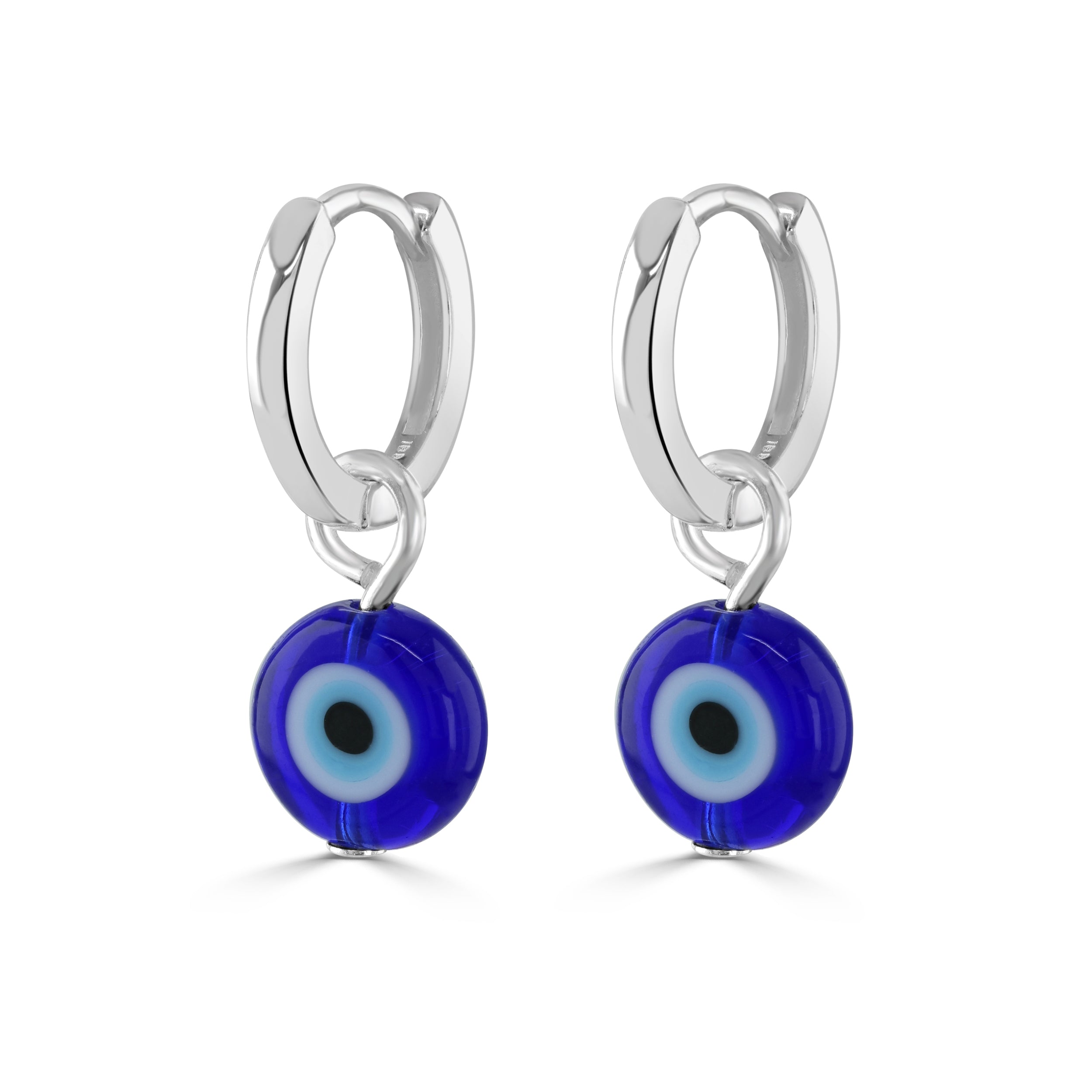 Evil eye charm on silver huggie hoops