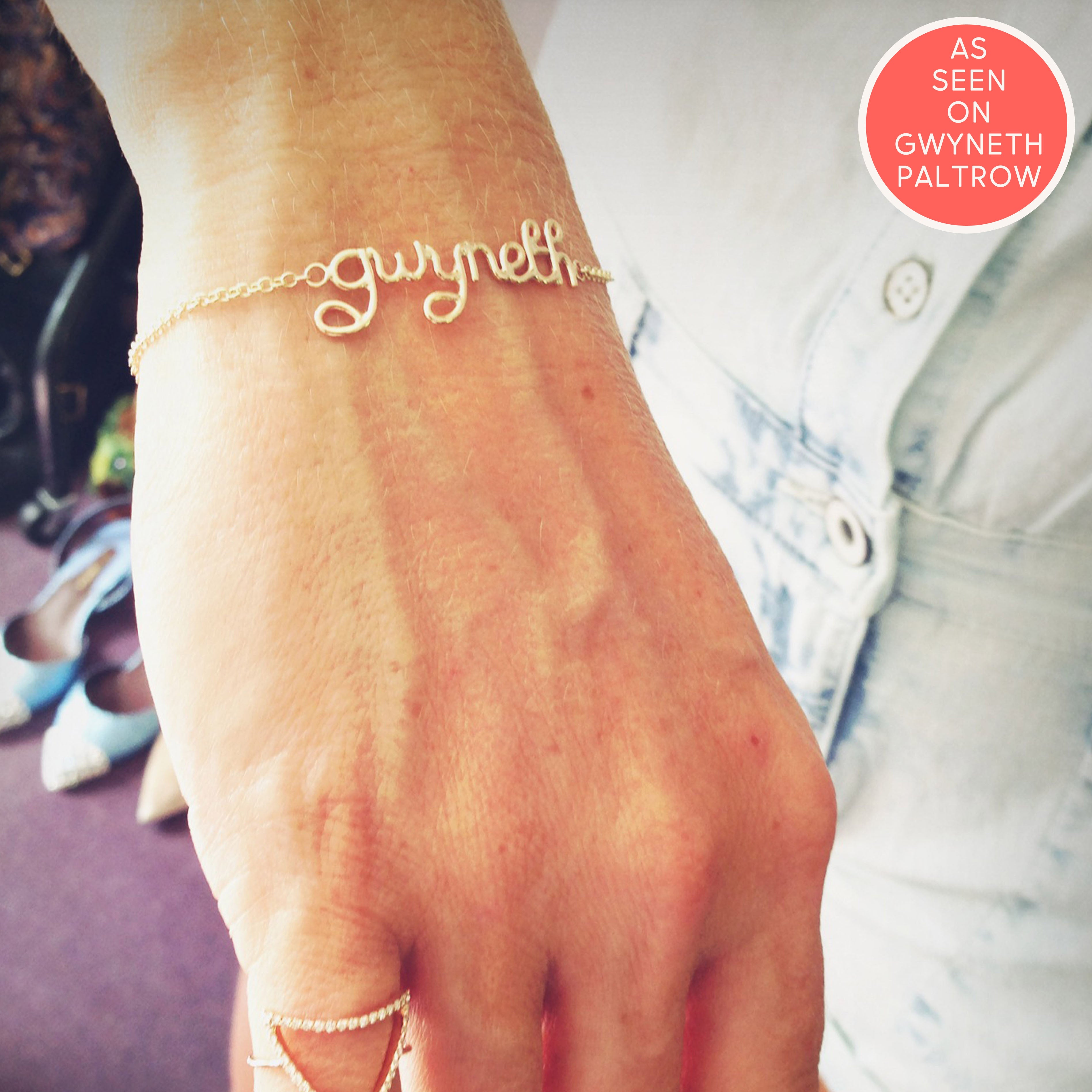 Gwyneth Paltrow wears personalised gwyneth bracelet in gold close up