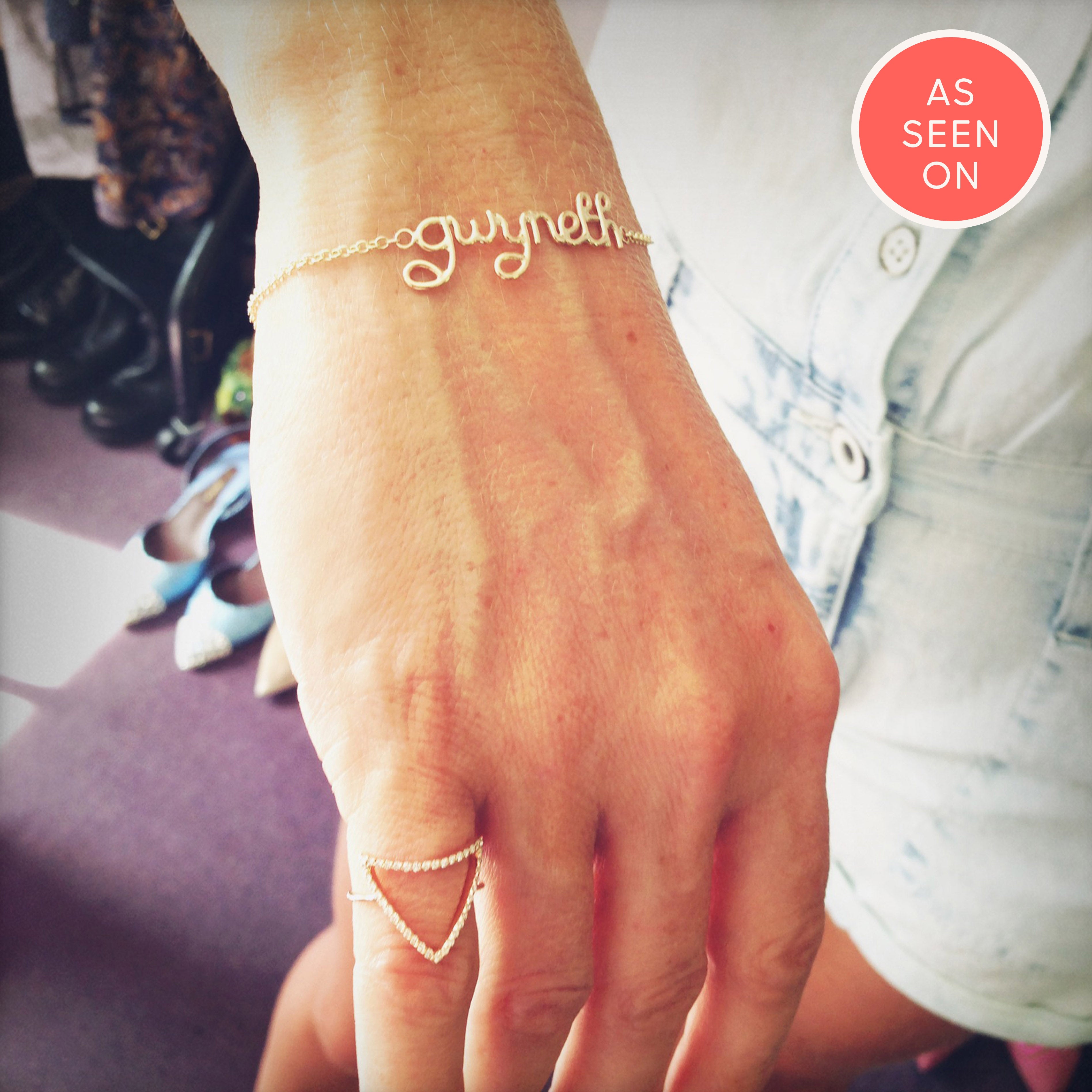 Gwyneth Paltrow wears personalised gwyneth bracelet in gold close up