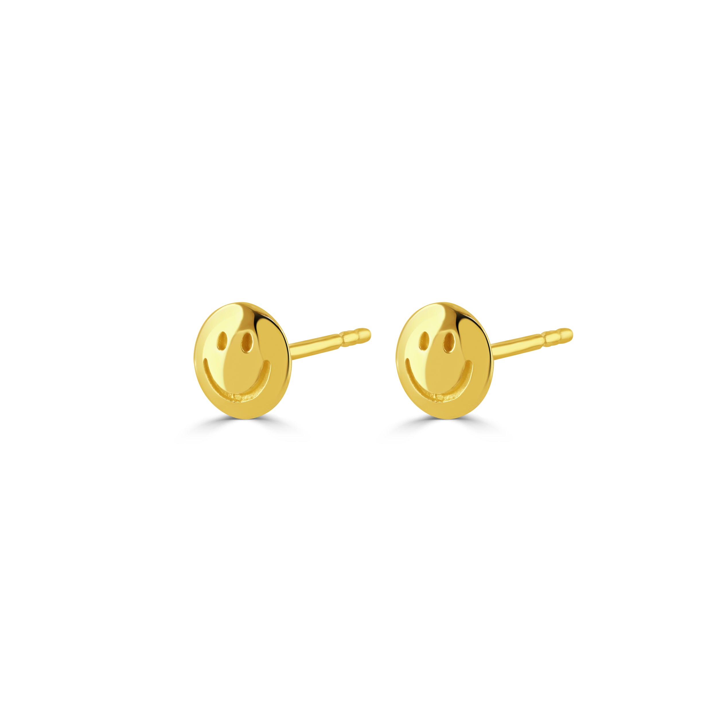 Gold happy face earrings on a white background