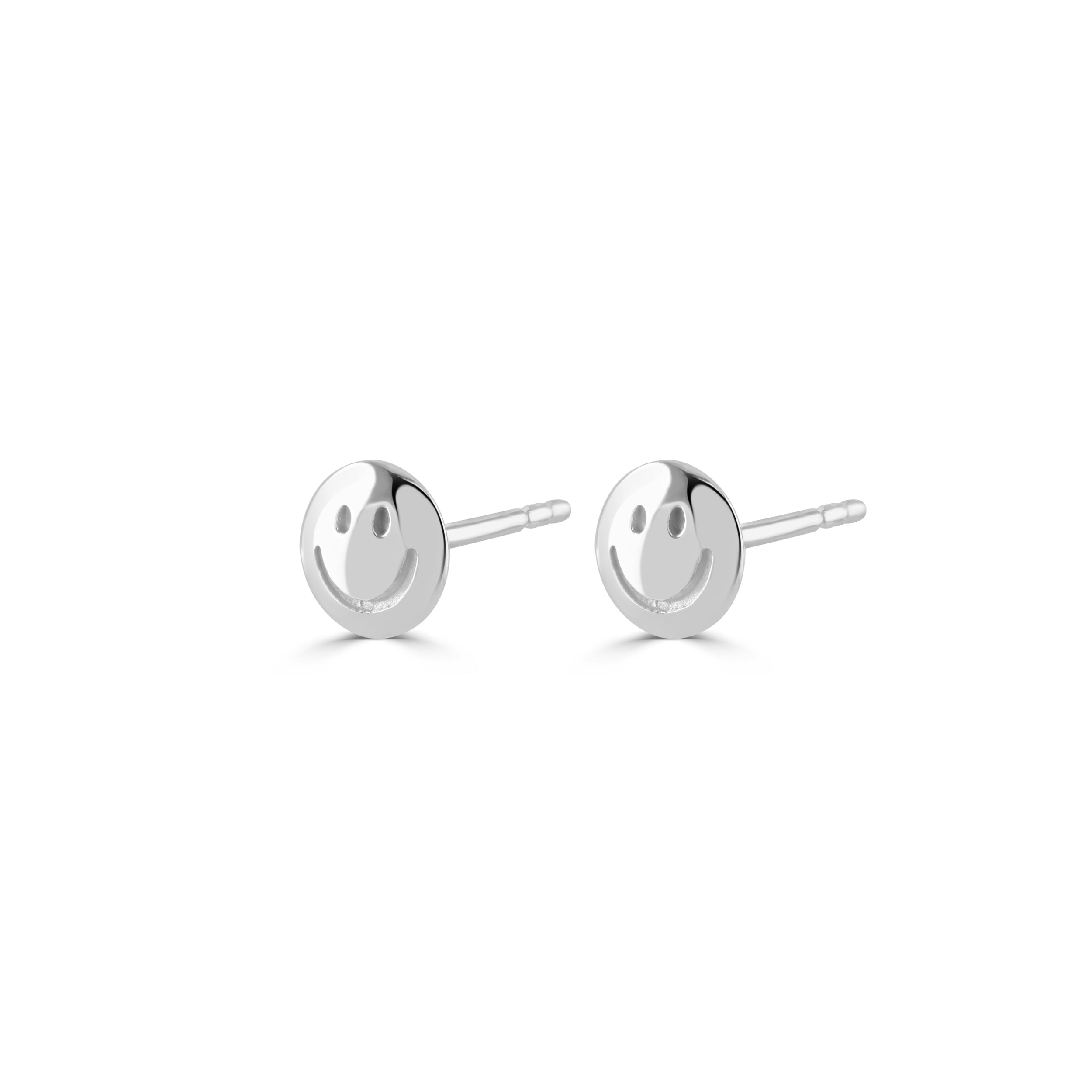 Silver happy face earrings on a white background