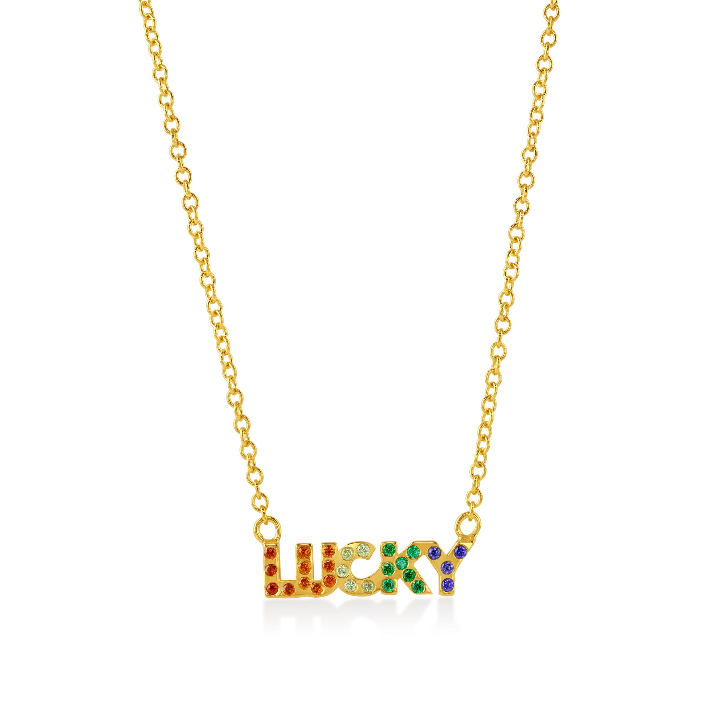 Gold necklace with 'LUCKY' set with rainbow gemstones on a coral background