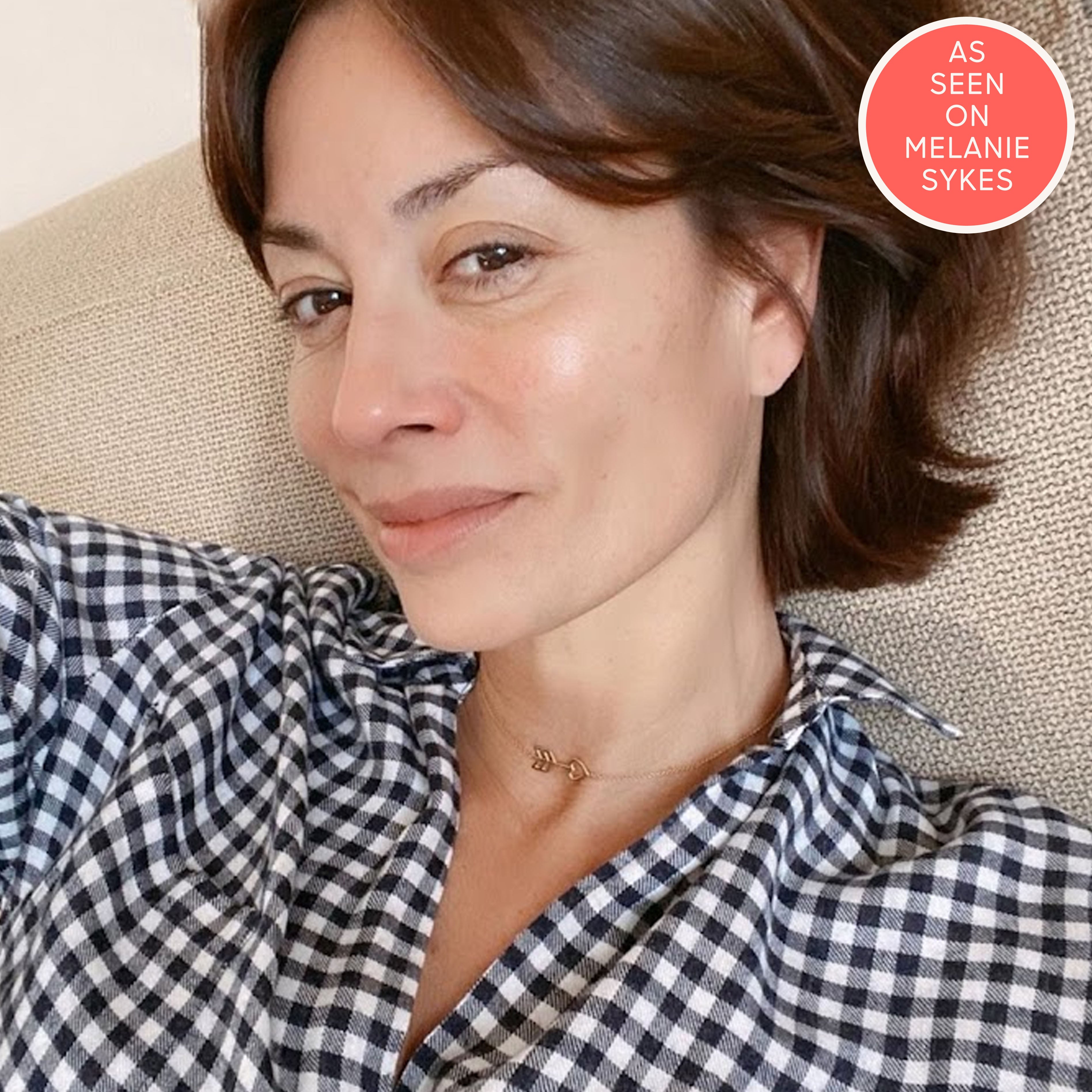 Melanie Sykes wears heart arrow necklace in gold