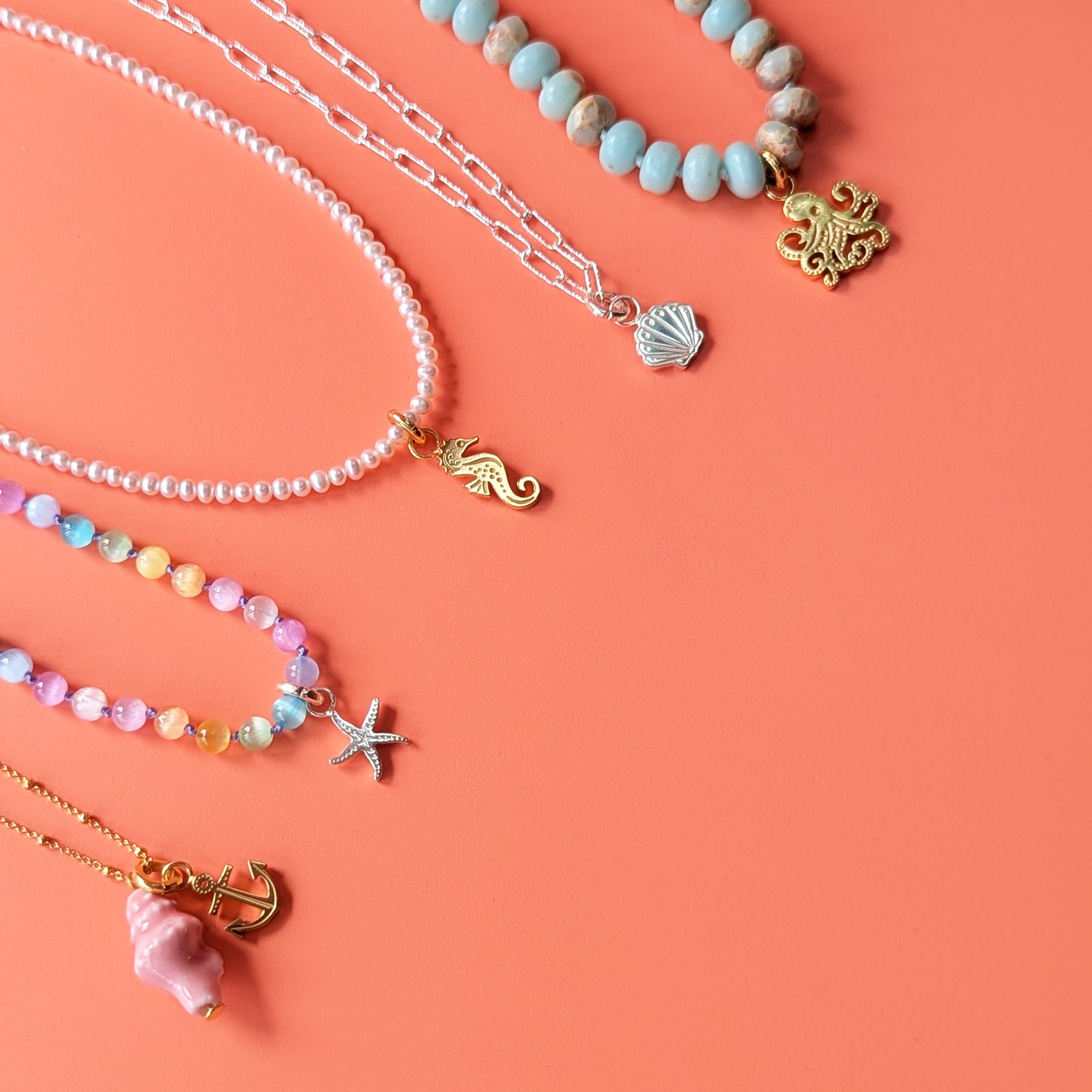 Ocean charms on a series of necklaces